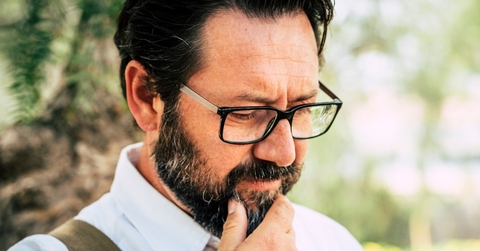 Man in his 50s thinking 