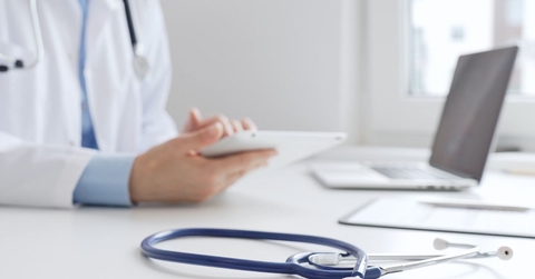 Doctor's office with a stethoscope in the foreground