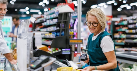 Senior woman working as a cashier 