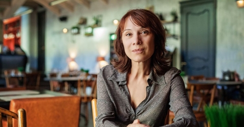 Mature woman sitting in restaurant