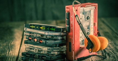 Walkman with headphones and cassette tapes