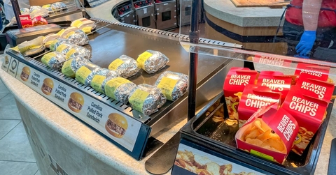 Buc-ee's food court display featuring wrapped sandwiches and Beaver Chips