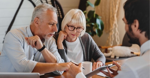 Elderly reviewing paperwork