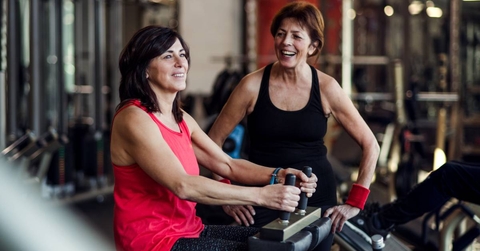 Two senior women working out at the gym
