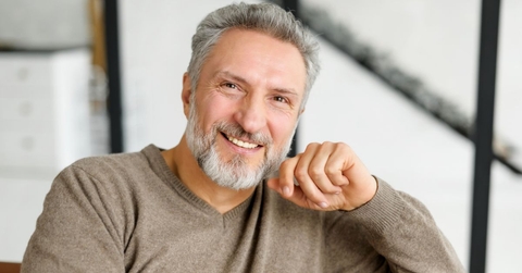 Portrait of a mature man in a brown sweater