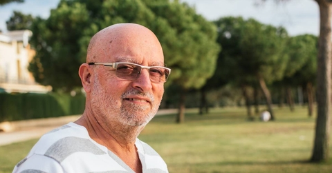 portrait of 65-year-old man in a park 