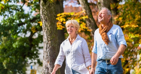 Older couple walking outdoors