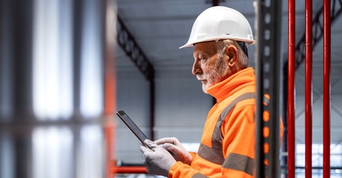 Senior male engineer in a warehouse