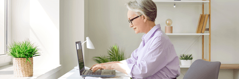 Woman sitting at home desk