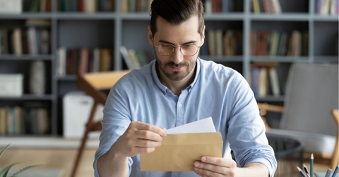 Person holding check