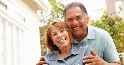 Smiling older couple in garden