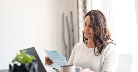 Mature woman reviewing a letter