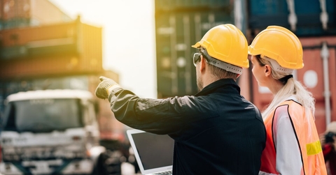 Workers in hard hats on a job site