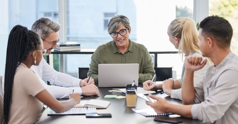 Mature business woman leading meeting