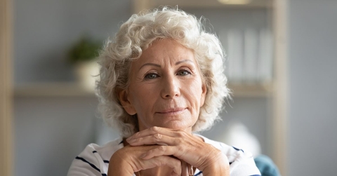 Portrait of a senior woman with her hands under her chin