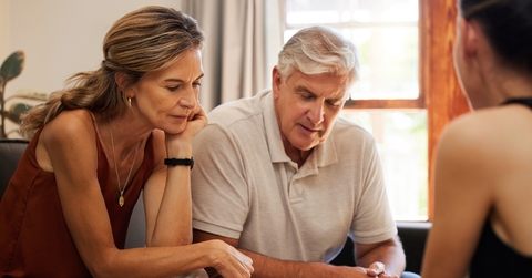 Retired couple looking at finances
