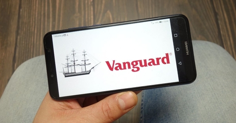 Hand holding smartphone with Vanguard on screen