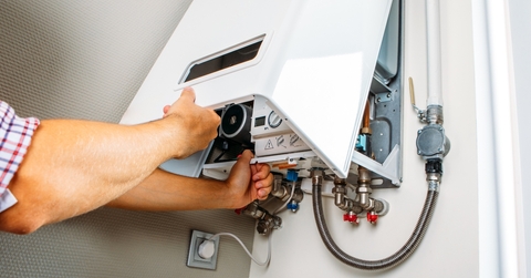 Hand opening electric panel on the wall