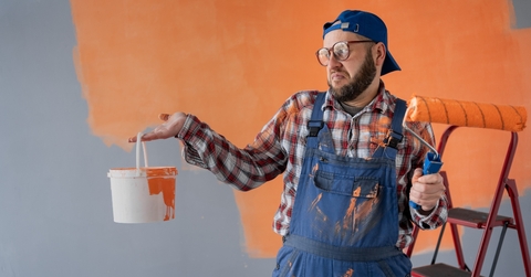 Man looking at paint