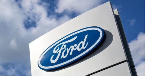 Ford dealership sign against blue sky