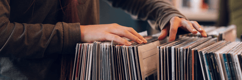 Going through vinyl records at store