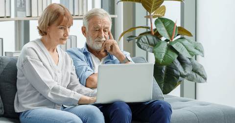 Senior couple looking at retiring and savings