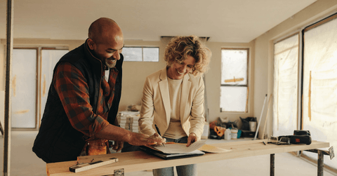 Woman signing contract for kitchen remodel