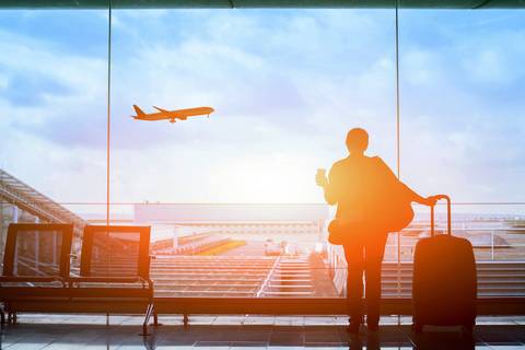 Traveler watching planes at airport