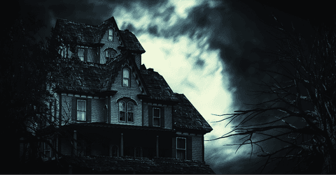 Spooky house under a stormy sky
