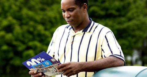 man getting mail from mailbox
