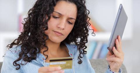 worried shopper buying online with credit card
