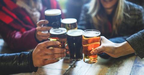 friends drinking and toasting beer