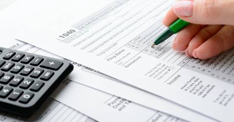 female hand and tax form