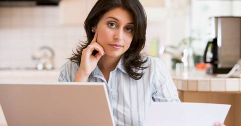 woman using laptop at home