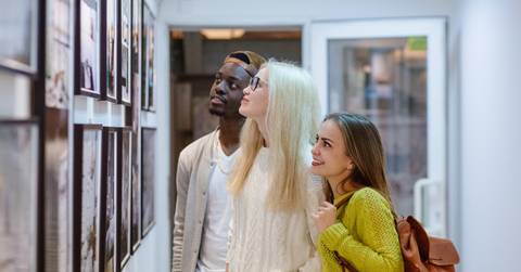 multi ethnic friends at art gallery