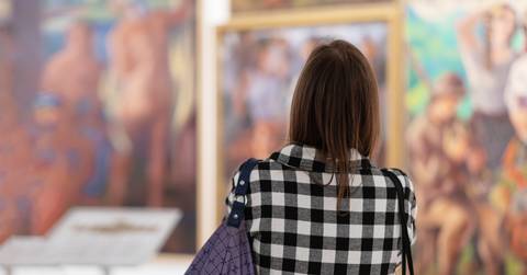 Woman visiting excursion in museum