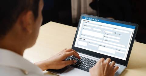 Man filling out online job application form
